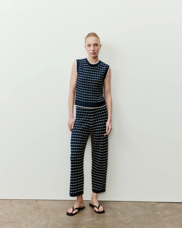 Emello Contrast Pointelle Knit Vest in navy with cream grid stitch, featuring wide shoulders and ribbed neckline.