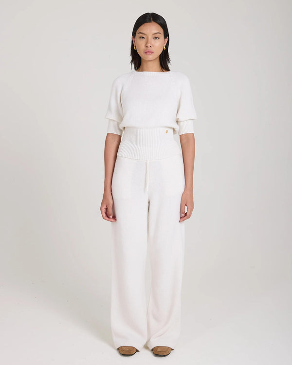 Cream puff sleeve sweater in merino wool and cashmere, worn elegantly by a model, showcasing tactile elegance and luxurious design.