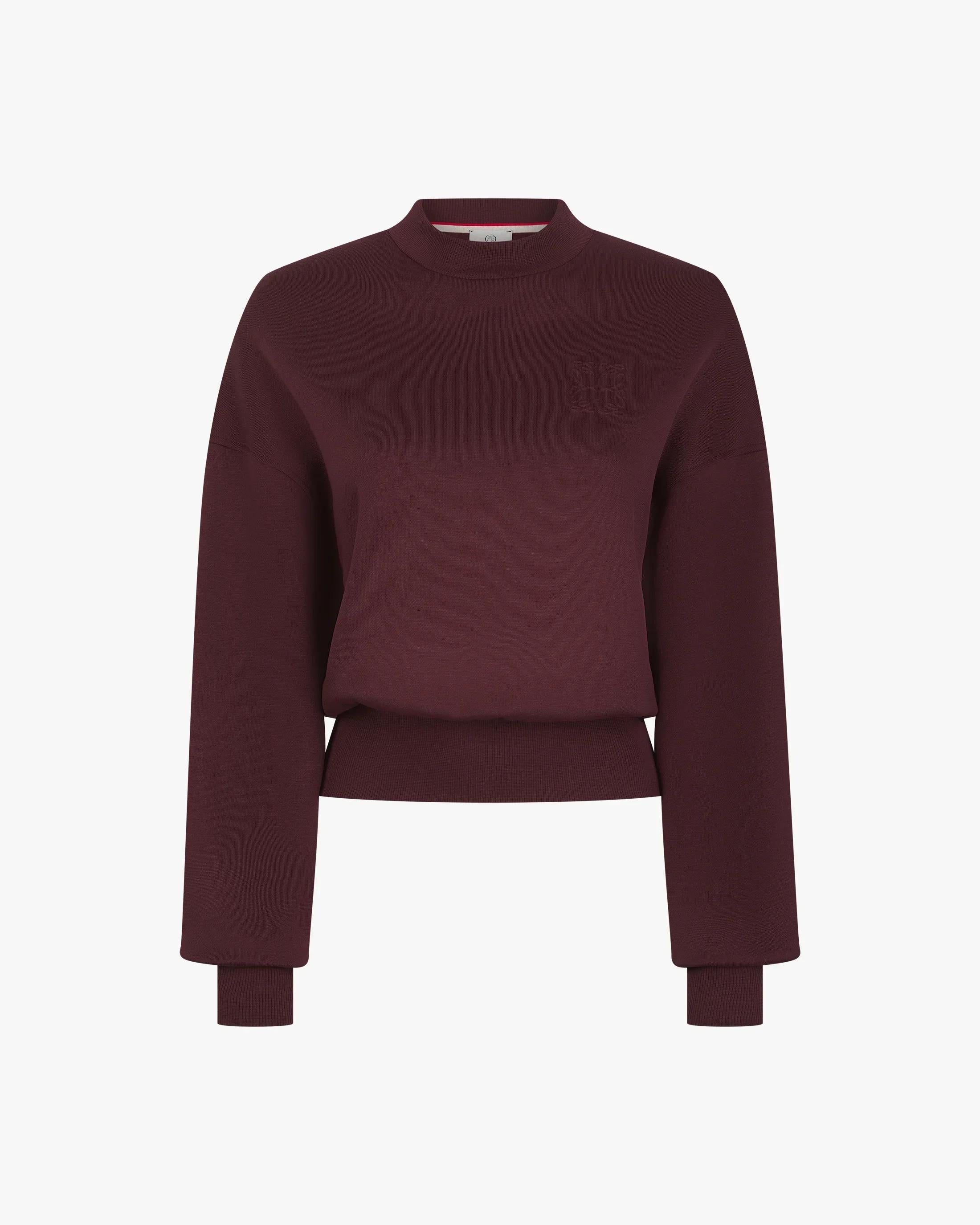 Elegant fig lyocell sweatshirt featuring debossed detail, drop shoulders, and a crew neck.
