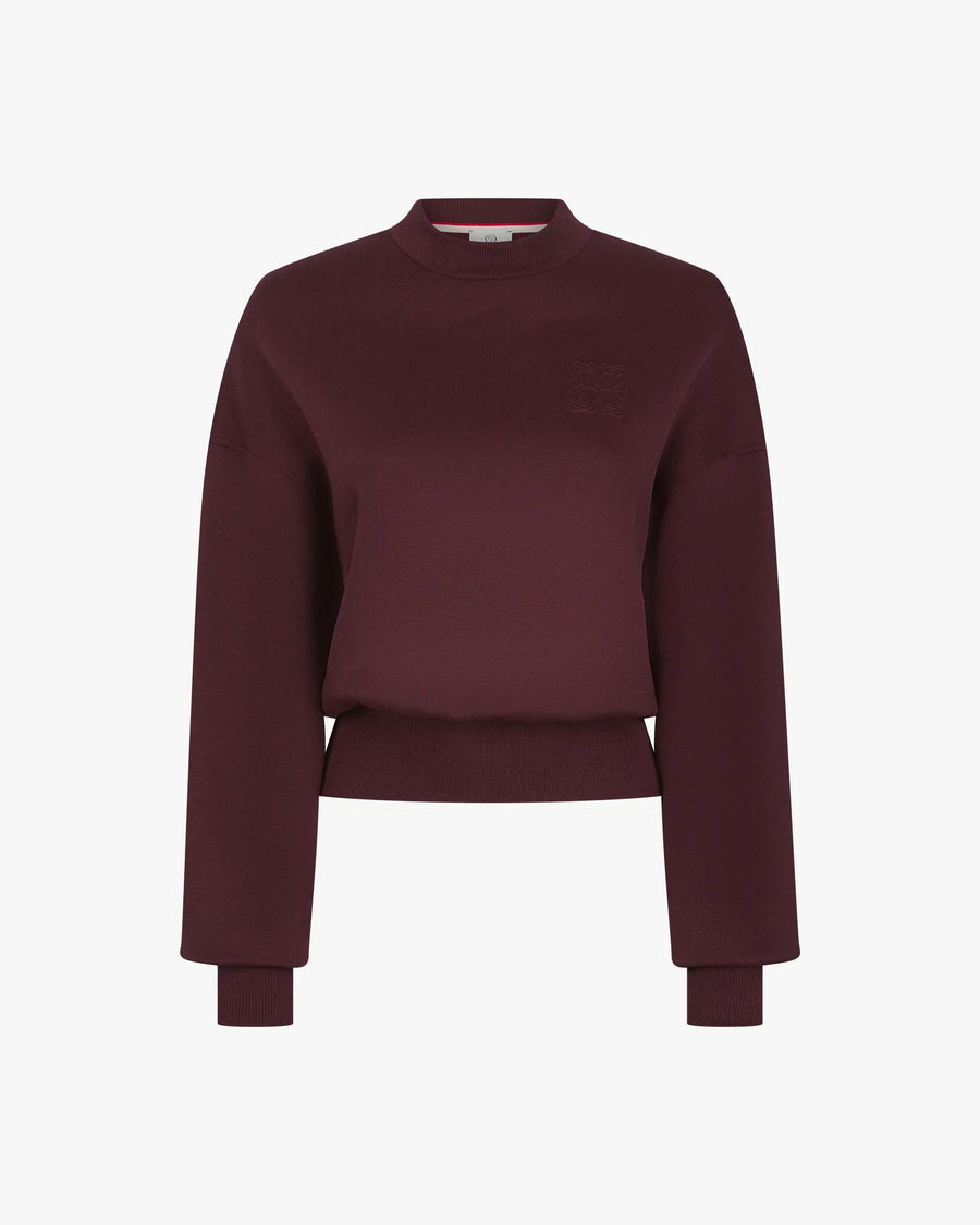 Elegant fig lyocell sweatshirt featuring debossed detail, drop shoulders, and a crew neck.