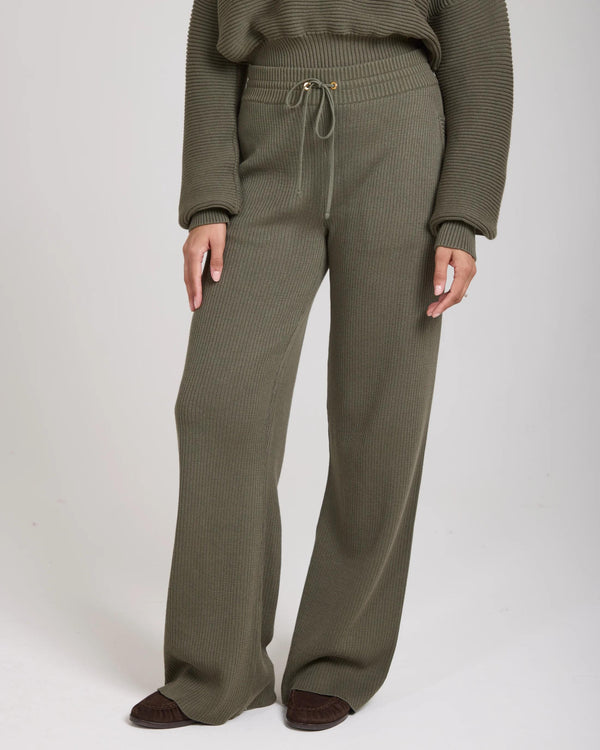 Emello Sorella Ribbed Knit Wide Leg Trousers in Olive, relaxed fit with a ribbed texture, featuring a drawcord waistband and gold accents.