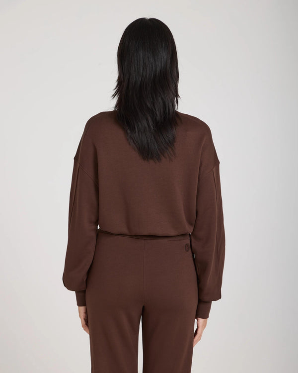 Back view of Emello's chocolate brown lyocell fleece sweatshirt featuring a relaxed fit and drop shoulder.