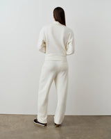Back view of Emello's Relaxed Straight Leg Trousers in cream, showcasing a fluid drape and comfortable fit.