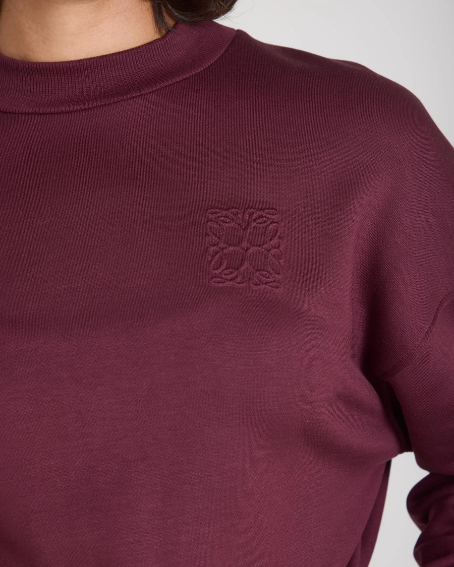 Fig-colored sweatshirt in buttery-soft lyocell with debossed logo detail.