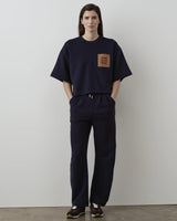 Relaxed Straight Leg Trousers in Navy by Emello, featuring a subtle volume and fluid drape, paired with a matching top for a refined set.