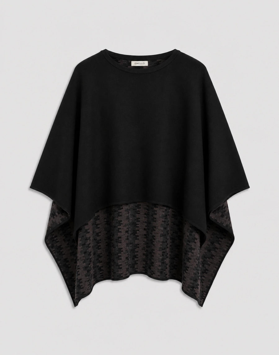 Elegant black cape with reversible design showcasing plain-knit and geometric patterns.