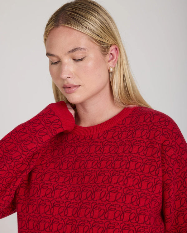 Reversible Jacquard Cashmere Sweater in red, embodying tactile elegance and refined luxury.