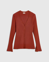 Rust red ribbed cardigan with V neckline and button front showcasing fluted cuffs.