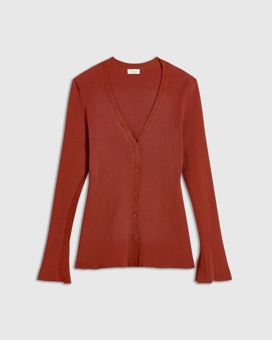 Rust red ribbed cardigan with V neckline and button front showcasing fluted cuffs.