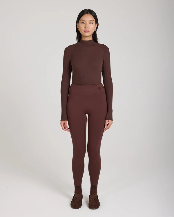 Emello's Ribbed Cotton Half-Crew Socks in Chocolate Brown worn by a model, showcasing refined elegance with embroidered detail.
