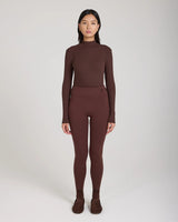 Emello's Ribbed Cotton Half-Crew Socks in Chocolate Brown worn by a model, showcasing refined elegance with embroidered detail.