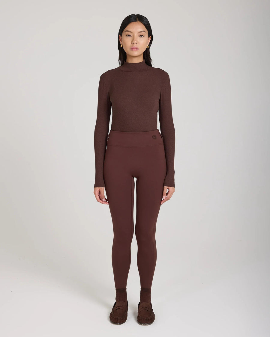 Emello's Ribbed Cotton Half-Crew Socks in Chocolate Brown worn by a model, showcasing refined elegance with embroidered detail.