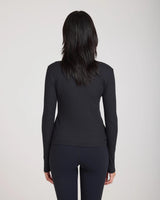 Back view of Emello Forma Ribbed Lyocell-Cotton Blend Turtleneck Top in black, showcasing slim fit and ribbed texture.