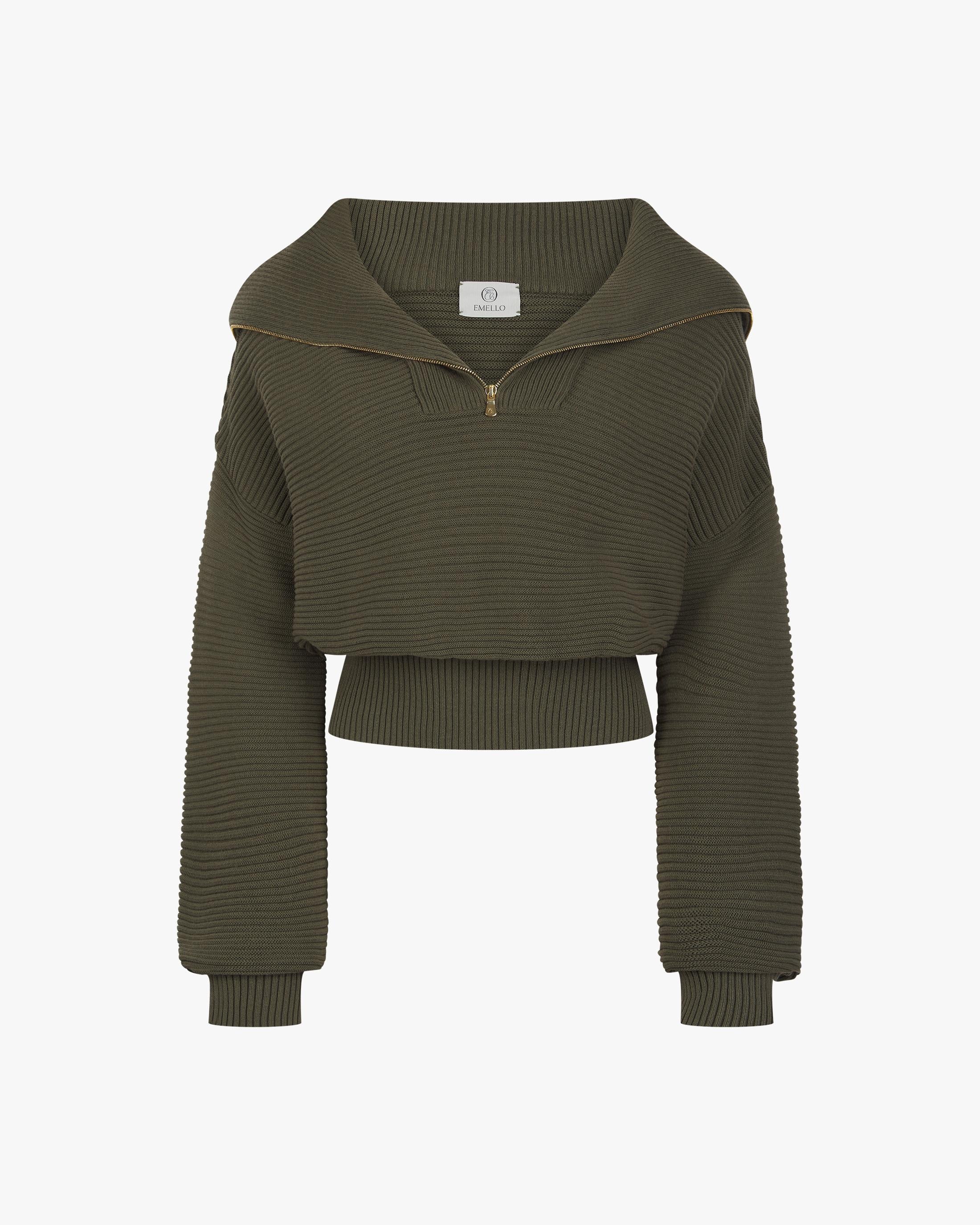 Olive ribbed half-zip cotton cashmere sweater featuring a high funnel neck and gold-finish zip, displayed against a neutral backdrop.