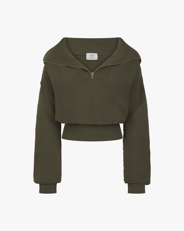 Olive ribbed half-zip cotton cashmere sweater featuring a high funnel neck and gold-finish zip, displayed against a neutral backdrop.