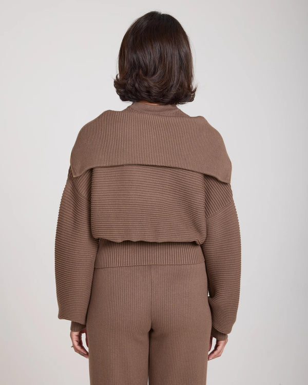 Back view of a taupe ribbed half-zip jumper in cotton-cashmere blend.