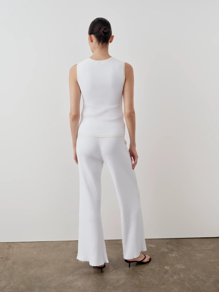 Back view of the Emello tonal ribbed knit tank top in bright cream, showcasing the wide shoulders and soft scoop neckline.