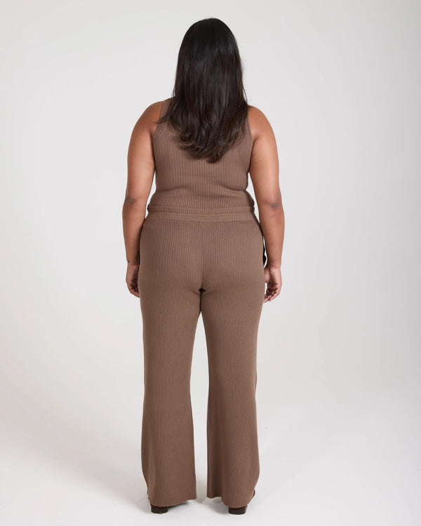 Taupe ribbed knit wide leg trousers by Emello, showcased from the back.