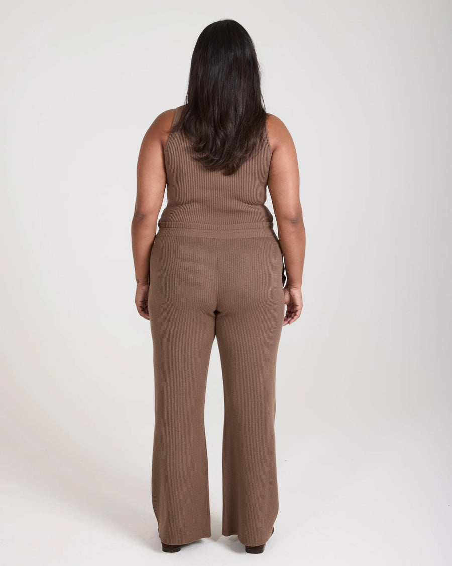 Taupe ribbed knit wide leg trousers by Emello, showcased from the back.