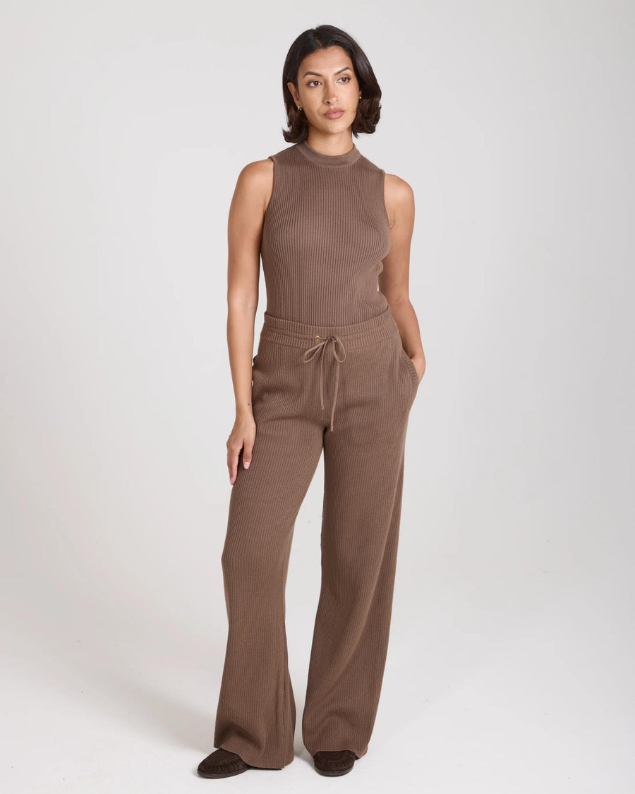 Model wearing Sorella Ribbed Knit Wide Leg Trousers in taupe with a relaxed fit.