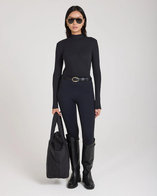 Forma Ribbed Lyocell-Cotton Blend Turtleneck Top in Black.