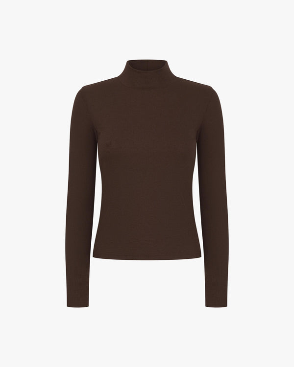 Chocolate brown ribbed turtleneck in lyocell-cotton blend with high collar, long sleeves.