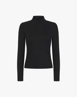 Black ribbed turtleneck top made from lyocell-cotton with an embroidered badge.