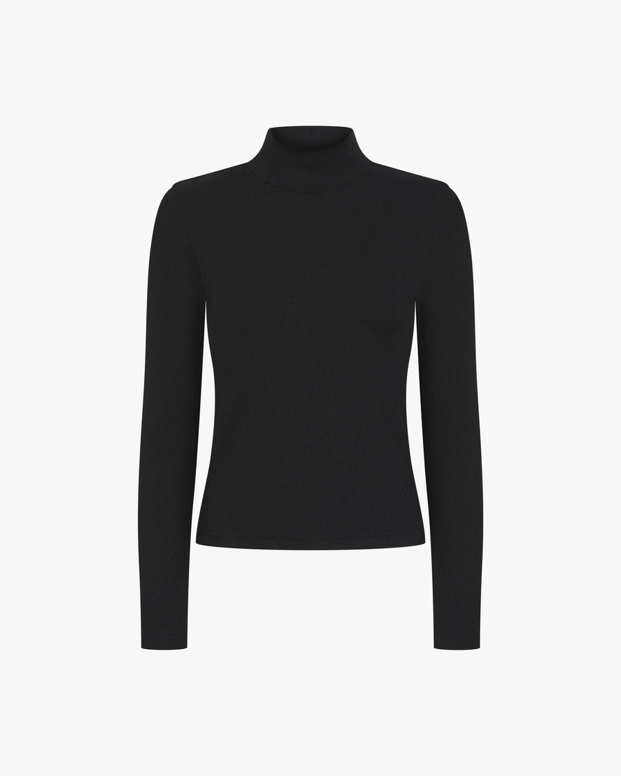 Black ribbed turtleneck top made from lyocell-cotton with an embroidered badge.