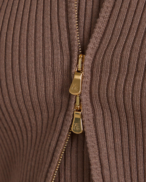 Close-up of Sorella Ribbed Zip Through Cardigan in taupe with gold-finish zip detail.
