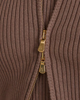 Close-up of Sorella Ribbed Zip Through Cardigan in taupe with gold-finish zip detail.