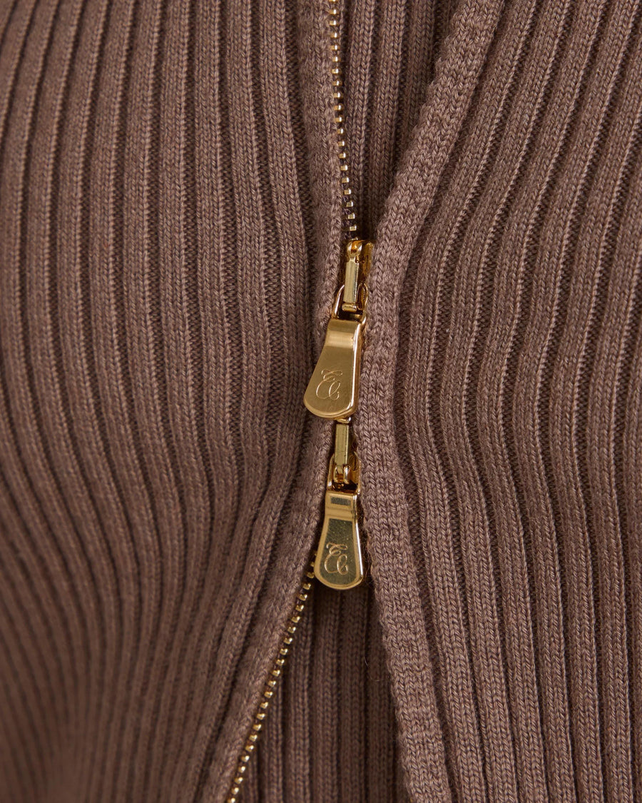 Close-up of Sorella Ribbed Zip Through Cardigan in taupe with gold-finish zip detail.