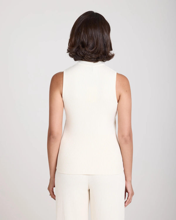 Back view of the Emello Sorella Ribbed Knit Vest in cream, showcasing the slim fit and ribbed texture.