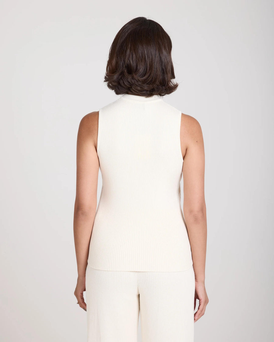 Back view of the Emello Sorella Ribbed Knit Vest in cream, showcasing the slim fit and ribbed texture.