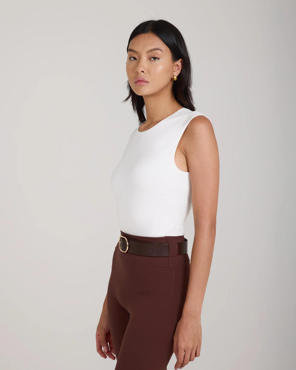 Forma Silky Lyocell Jersey Double-Layer Vest in Cream, worn by a model, displaying a slim fit, sleeveless design, with a crew neck.