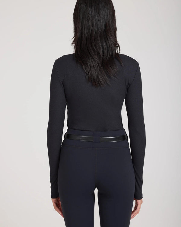 Emello Forma Super Soft Sculpting Leggings with Belt Loops in Black, showcasing the back view with a clean-finished hem and embroidered logo badge.