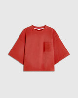 Red short sleeve sweatshirt with chest pocket and tonal embroidery, showcasing a relaxed, boxy silhouette.