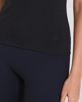 Close-up of Emello's Forma Silky Lyocell Double-Layer Top in black, showcasing the tactile elegance and fine craftsmanship.