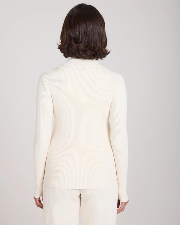 Back view of Sorella Ribbed Zip Through Cardigan in Cannoli Cream, showing ribbed texture and slim fit.
