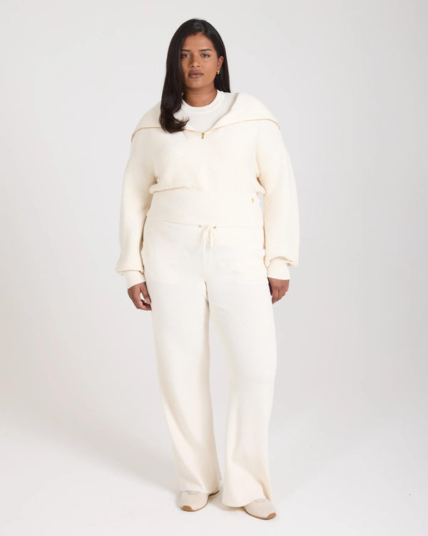 Sorella Ribbed Knit Wide Leg Trousers in Cream, featuring gold embellishments and relaxed fit.