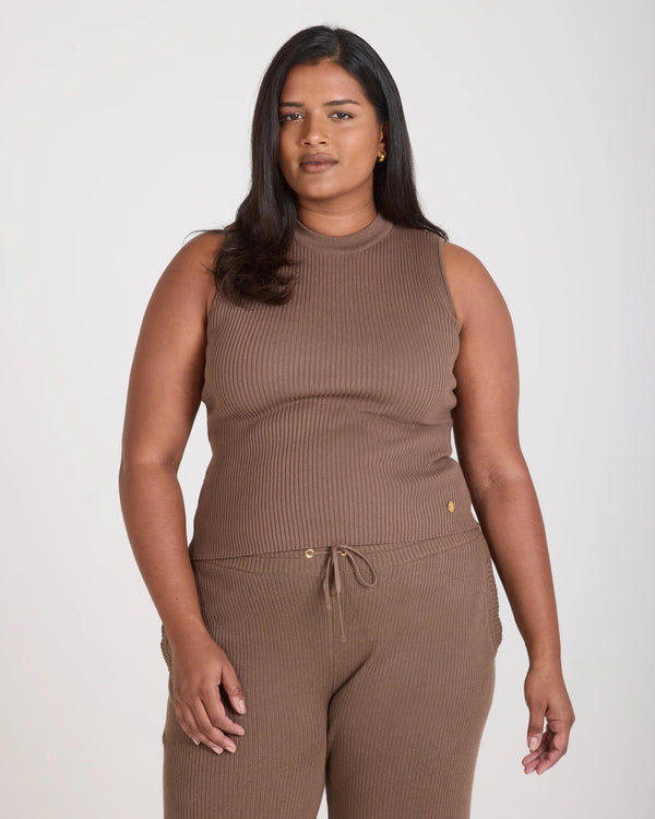 Sorella Ribbed Knit Vest in Taupe, worn by a model in a relaxed stance.