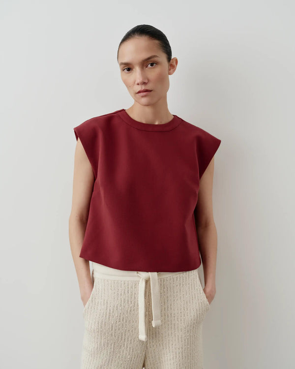 Emello Structured Layered Vest in a deep fig hue with strong shoulders and a layered design.