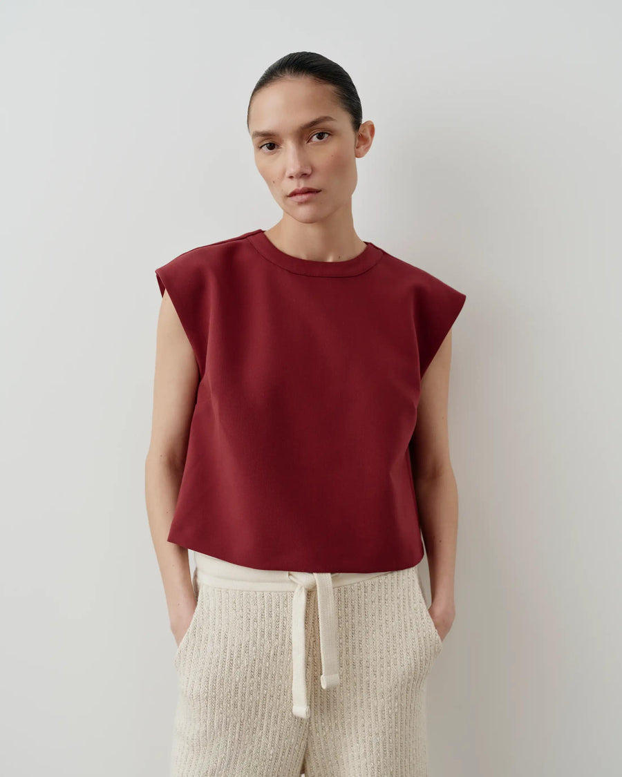 Emello Structured Layered Vest in a deep fig hue with strong shoulders and a layered design.