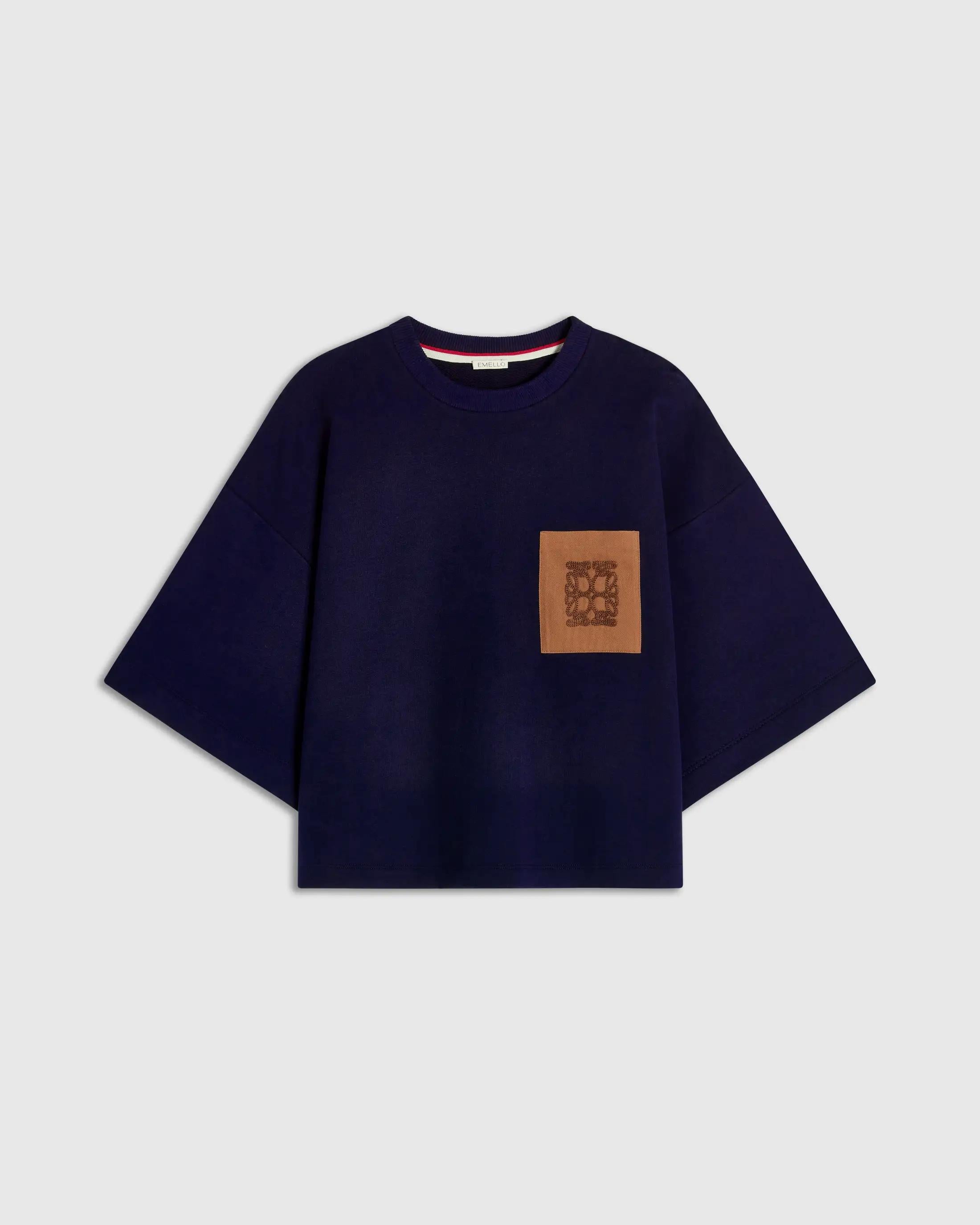 Navy short sleeve pocket sweatshirt with relaxed boxy silhouette and chest pocket.