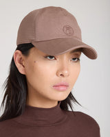 Emello Cap in Taupe; crafted in brown brushed cotton elastane twill with 30 mm embroidered signature.