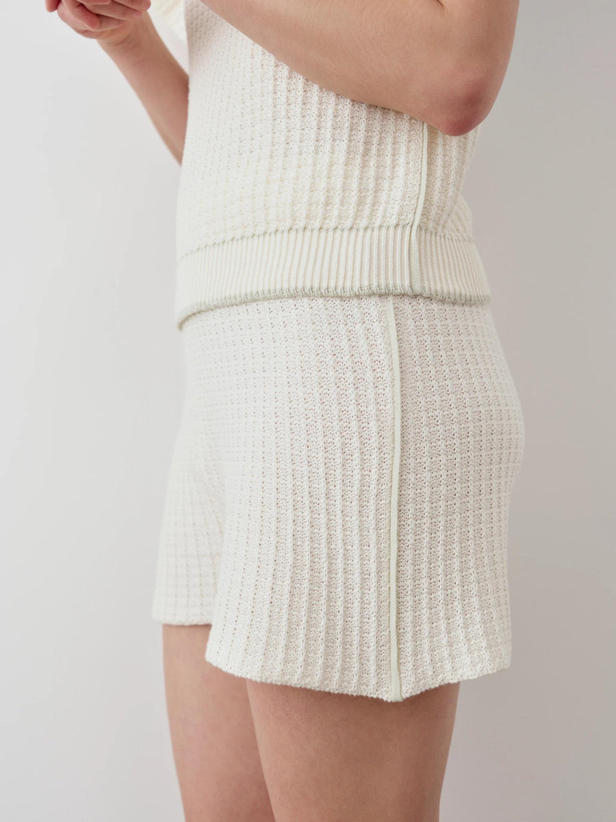 Textured Knit Shorts in white, showcasing breathable crochet-effect with softly fluted shape and contrast seams.