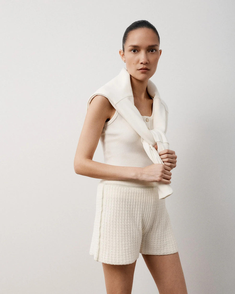Luxurious textured knit shorts in white showcasing a soft elasticated waistband and relaxed fit.