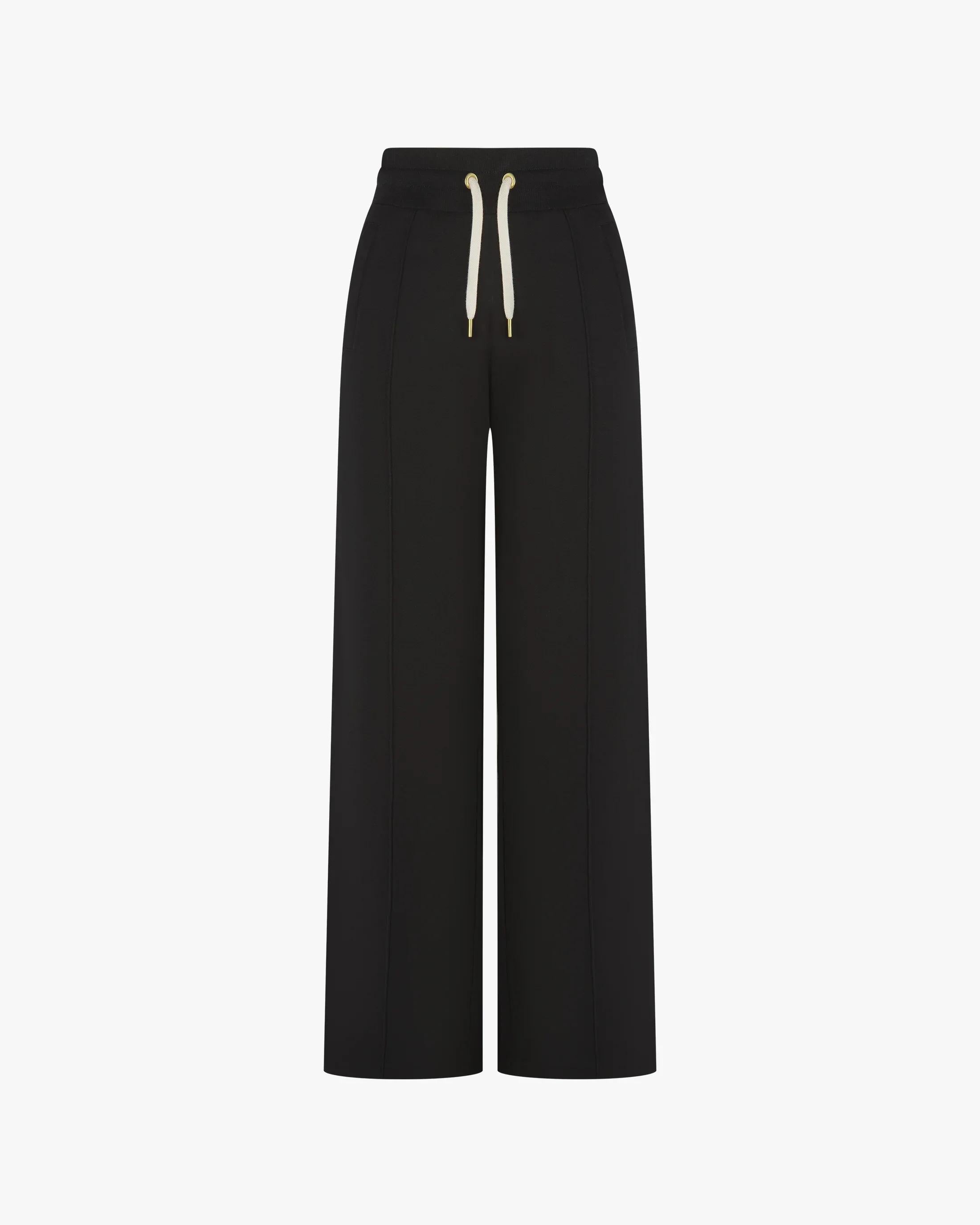 Refined black lyocell trousers with wide-leg fit and pin-tuck detailing.