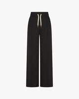 Refined black lyocell trousers with wide-leg fit and pin-tuck detailing.