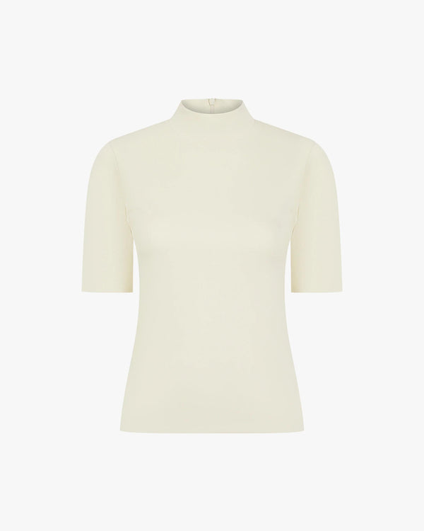 Cream viscose double layer high neck top with short sleeves, elegantly streamlined.