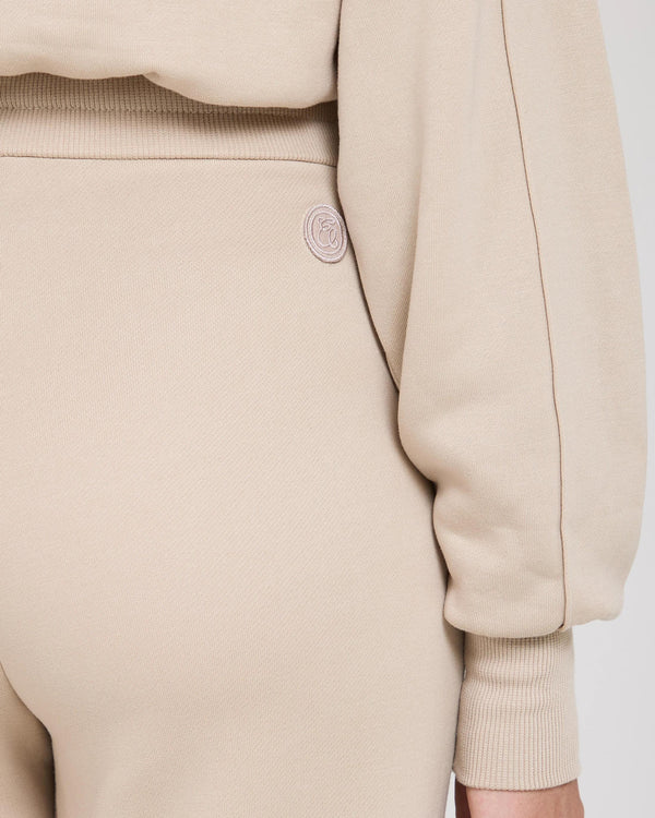 Mello Lyocell Fleece Wide Leg Pants in Beige with gold accent detail